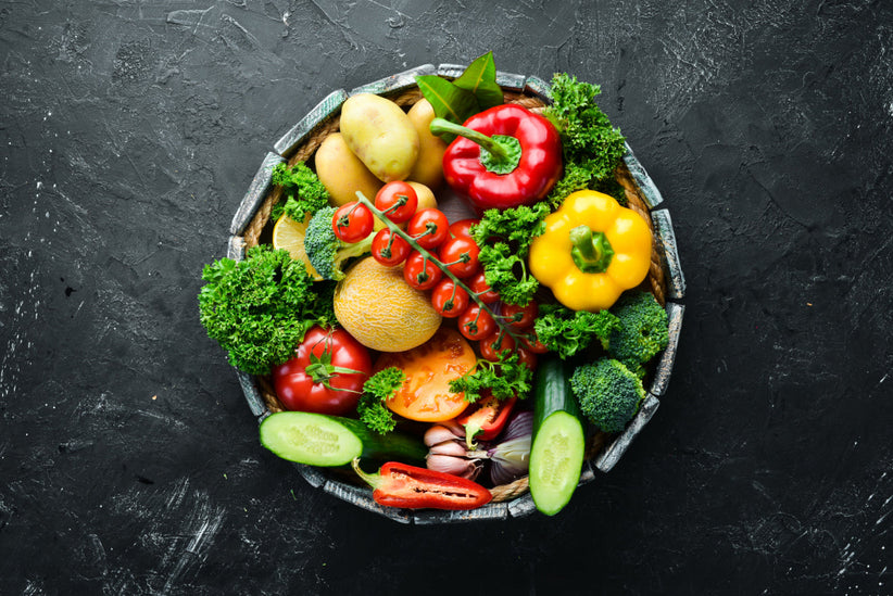 Top down view of a bowl of healthy fruits and vegetables